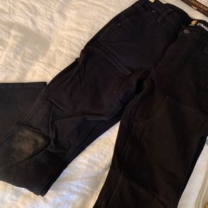 Carhartt women’s straight leg utility jeans with dirt-smudged knees